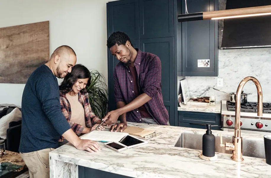 A couple making a financial decision happily in their home