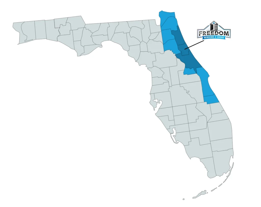A map showing Freedom Windows and Doors service area in Northeast Florida: A line shows that the company is based in Flagler county. St. Johns, Flagler, and Volusia counties are colored in a dark blue, indicating a primary service area. Nassau, Duval, Clay, Putnam, Seminole, Brevard, and Indian River counties are colored in a lighter blue, where Freedom Windows and Doors also service homes. The rest of the state is colored grey, where Freedom does not currently service.